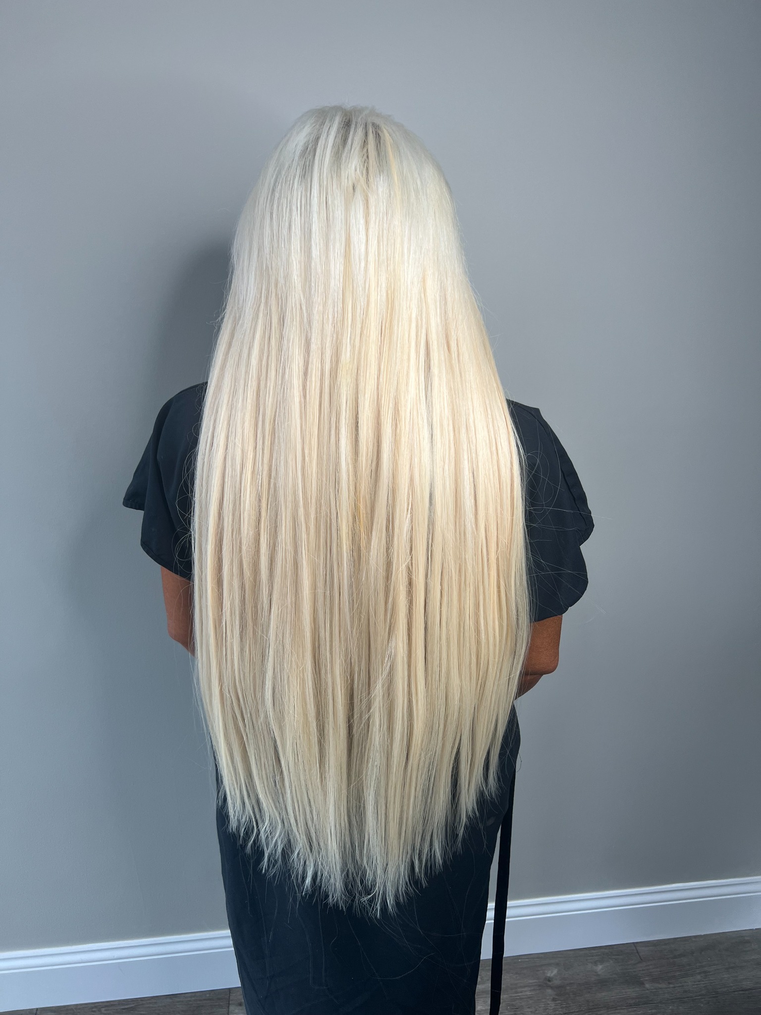 Back view of long platinum blonde extensions