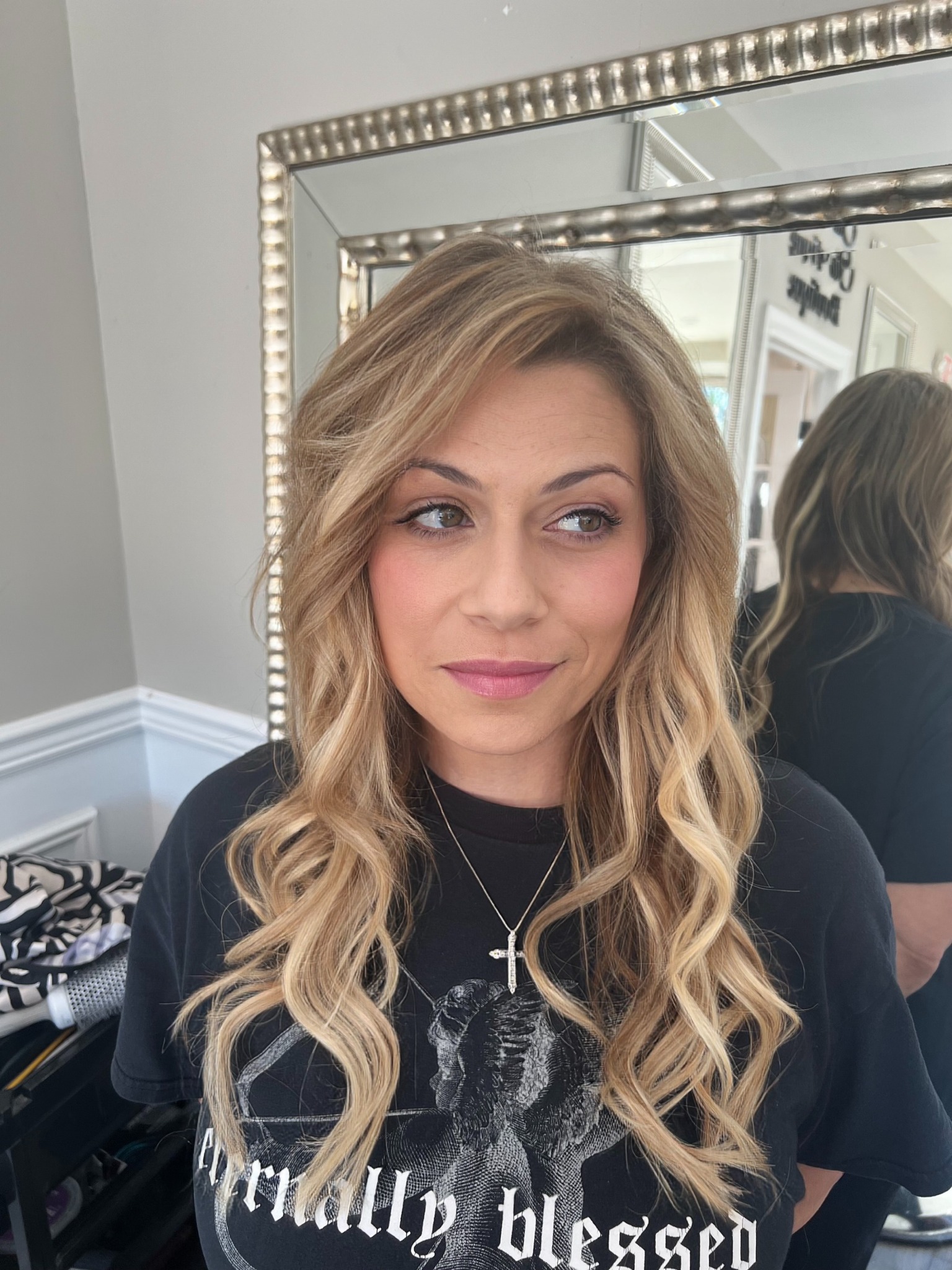 Dimensional blonde color and curled styling